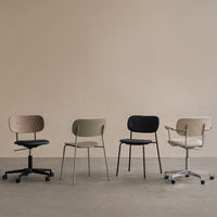 Four stylish office chairs in natural wood, olive green, black, and soft beige against a neutral backdrop.