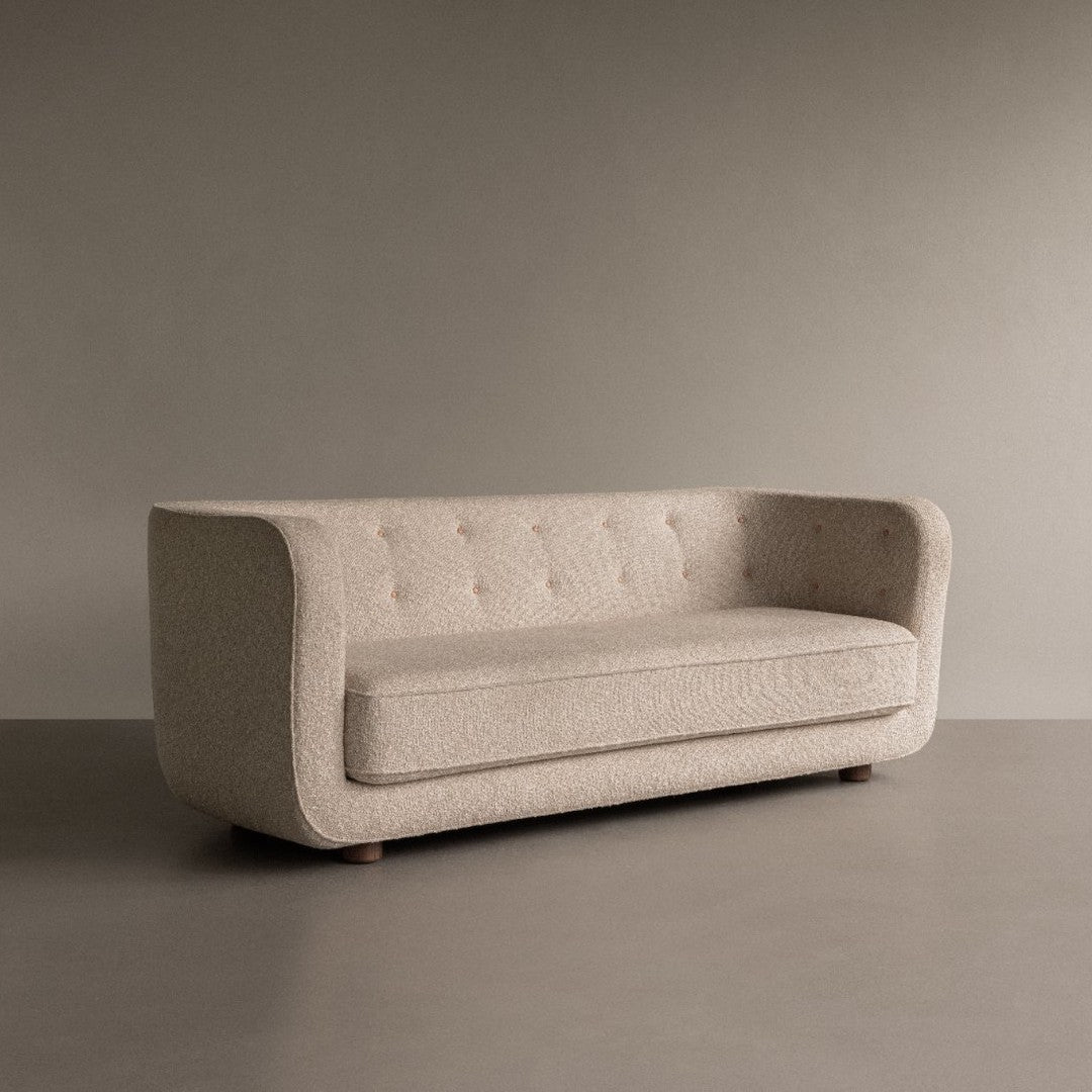 Textured beige sofa with a minimalistic design and subtle tufted pattern, perfect for modern interiors.