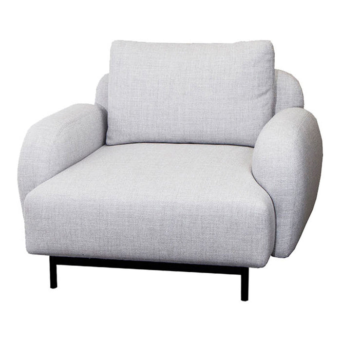 Light gray upholstered armchair with a smooth texture and minimalist design, featuring rounded arms and a sleek black base.