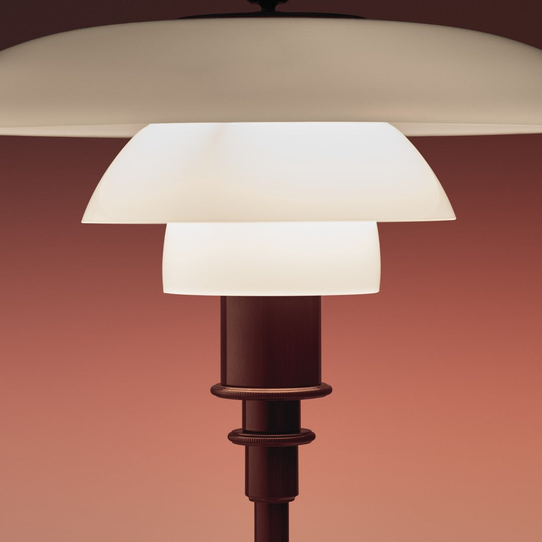 Stylish white lampshade with a layered design, complemented by a sleek brown base against a warm gradient background.
