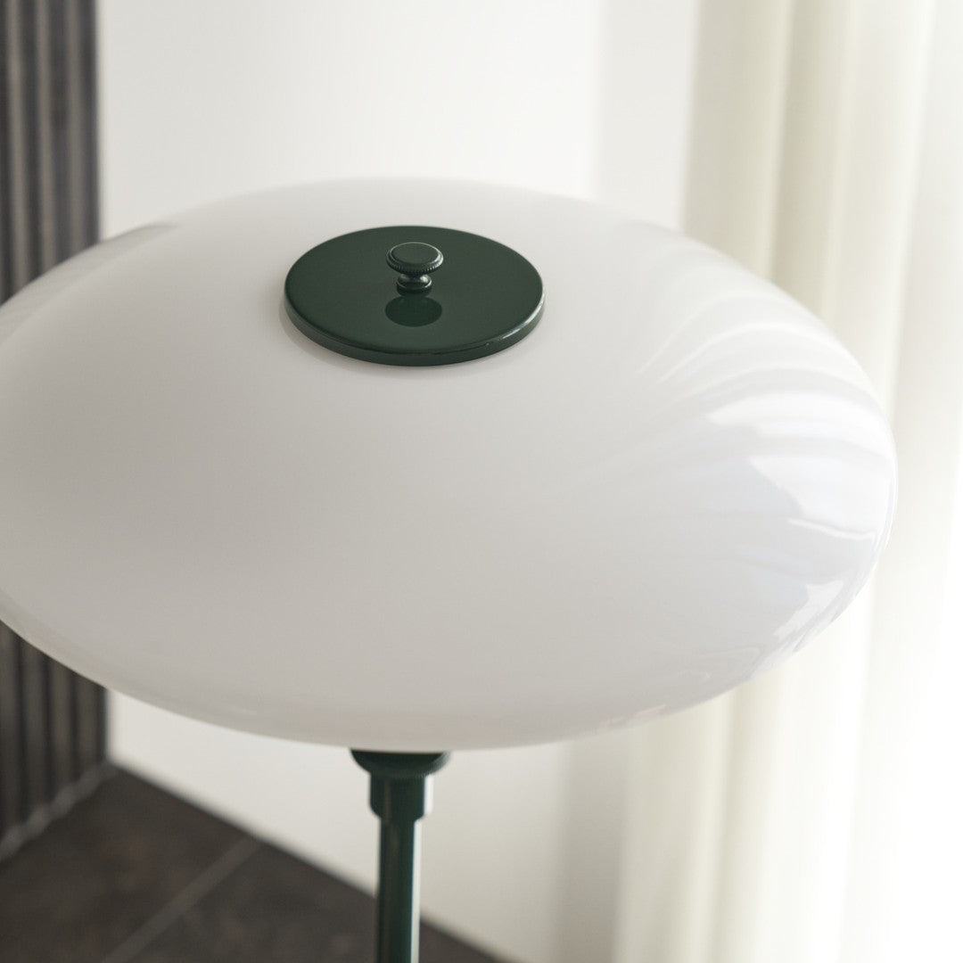 White glass lamp shade with a smooth, glossy finish and a dark green accent at the top.