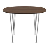 Round wooden dining table in rich brown with sleek silver metal legs. Minimalist design, perfect for modern decor.