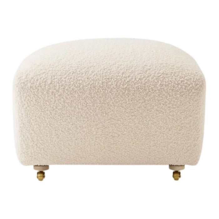 Beige textured ottoman with a soft, fluffy surface and gold-plated feet, perfect for modern decor.