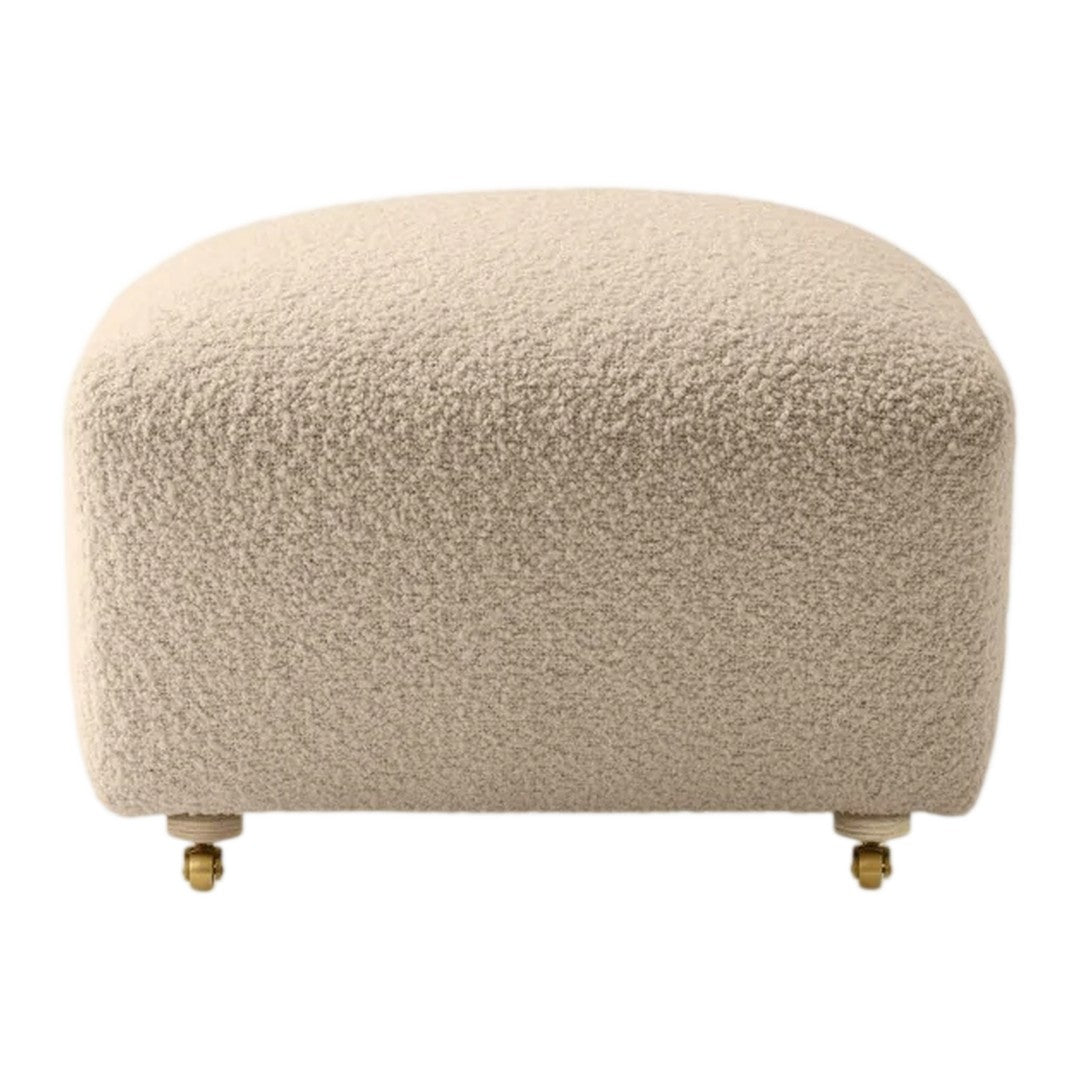 Cream-colored upholstered ottoman with a textured pattern, featuring gold legs for an elegant touch.