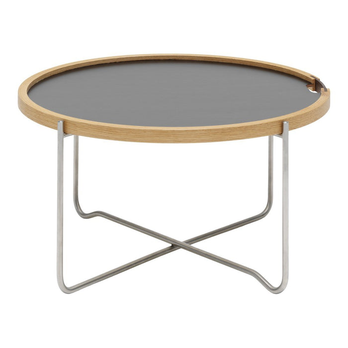 Round coffee table featuring a sleek black top and natural wood rim, supported by a minimalist silver metal base.