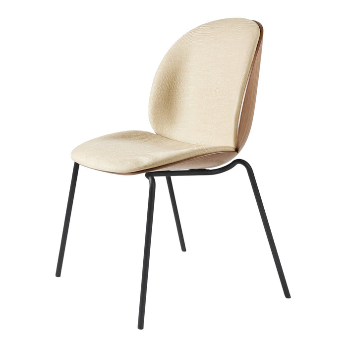 Beige upholstered chair with a smooth texture and black metal legs for a modern look.