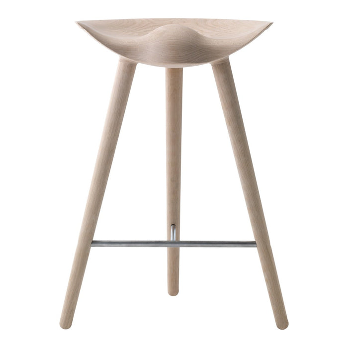 Natural wood bar stool with a smooth, curved seat and slender legs, showcasing a minimalistic design in light tones.