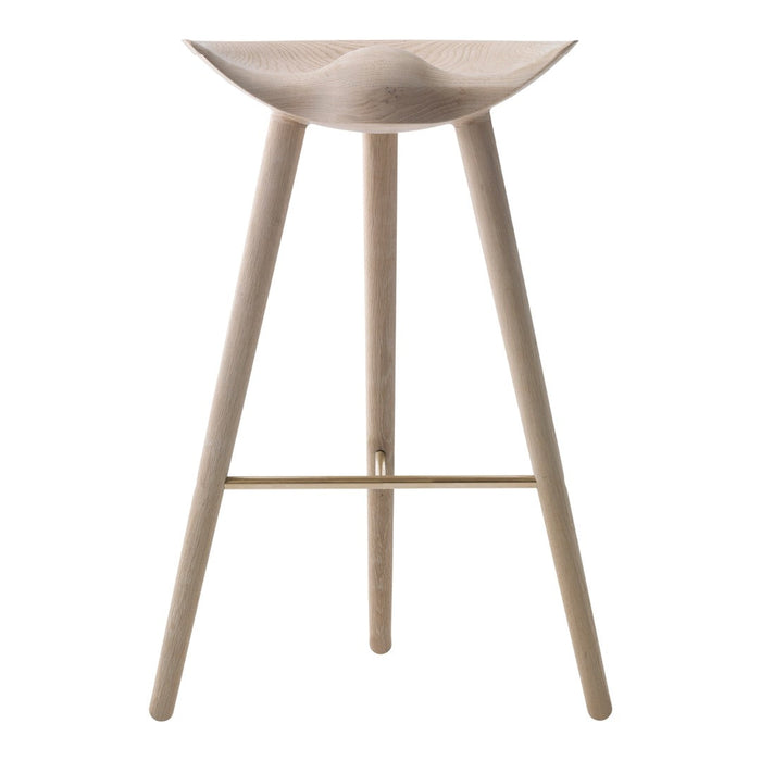 Light wood bar stool with a smooth curved seat and minimalist design, complemented by slender legs and a subtle gold accent.