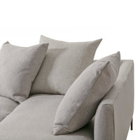 Light gray sofa with textured cushions, featuring a modern, minimalist design for stylish interiors.