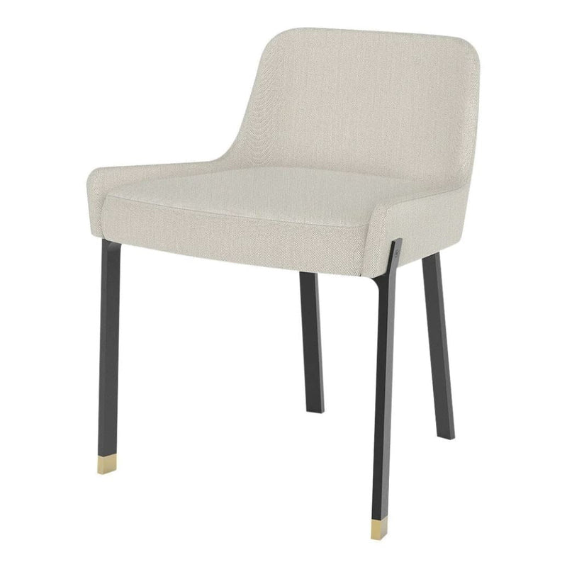 Beige upholstery chair with sleek black legs and gold accents, featuring a modern, minimalist design.
