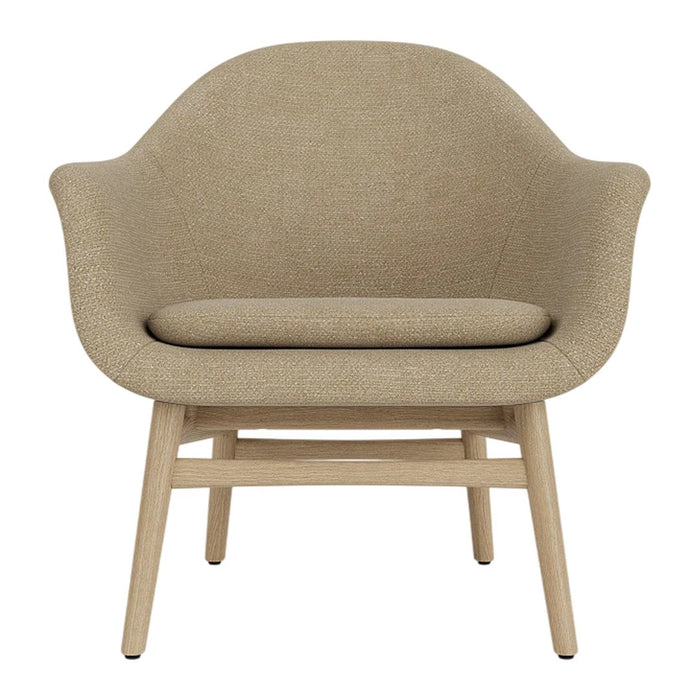 Beige upholstered chair with a smooth, rounded silhouette and wooden legs, perfect for modern decor.
