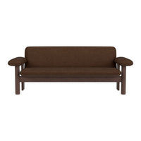 Brown fabric sofa with a solid wood frame and minimalist design, featuring simple lines and smooth contours.