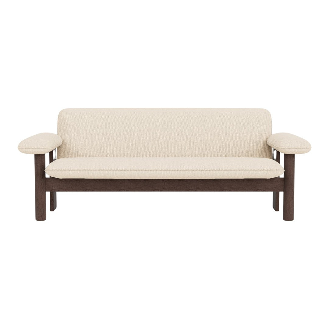Cream-colored couch with dark brown wooden frame and simple, clean lines. Perfect for modern decor.