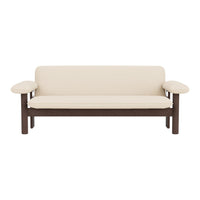 Cream-colored couch with dark brown wooden frame and simple, clean lines. Perfect for modern decor.