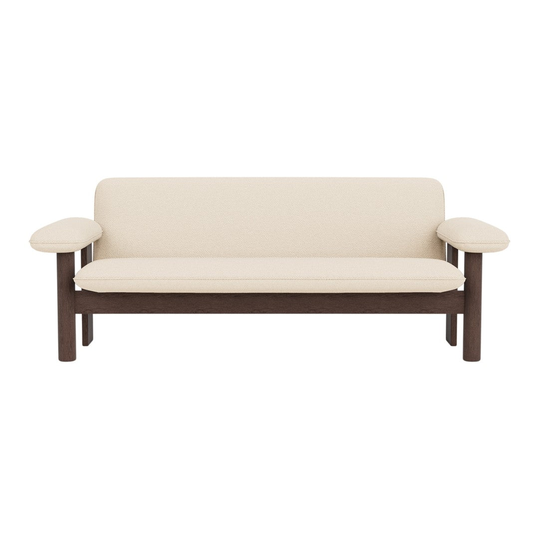 Beige sofa with a dark wood frame and simple, modern design. No patterns, soft cushions for comfort.