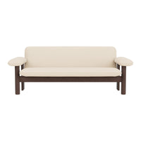 Beige sofa with a dark wood frame and simple, modern design. No patterns, soft cushions for comfort.