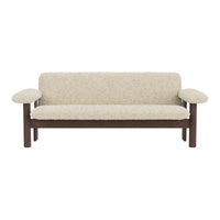 Beige upholstered sofa with a textured pattern and wooden frame, featuring rounded armrests for a cozy look.