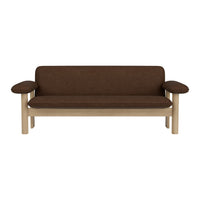 Brown upholstered sofa with light wooden frame and smooth, clean lines. Ideal for modern living spaces.