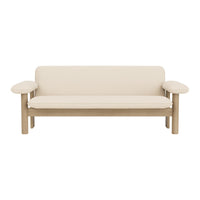 Minimalist cream sofa with light wooden arms, featuring a sleek, solid design and no visible patterns.