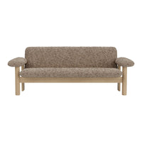 Brown textured fabric sofa with rounded armrests and a light wood frame, showcasing a cozy, contemporary design.
