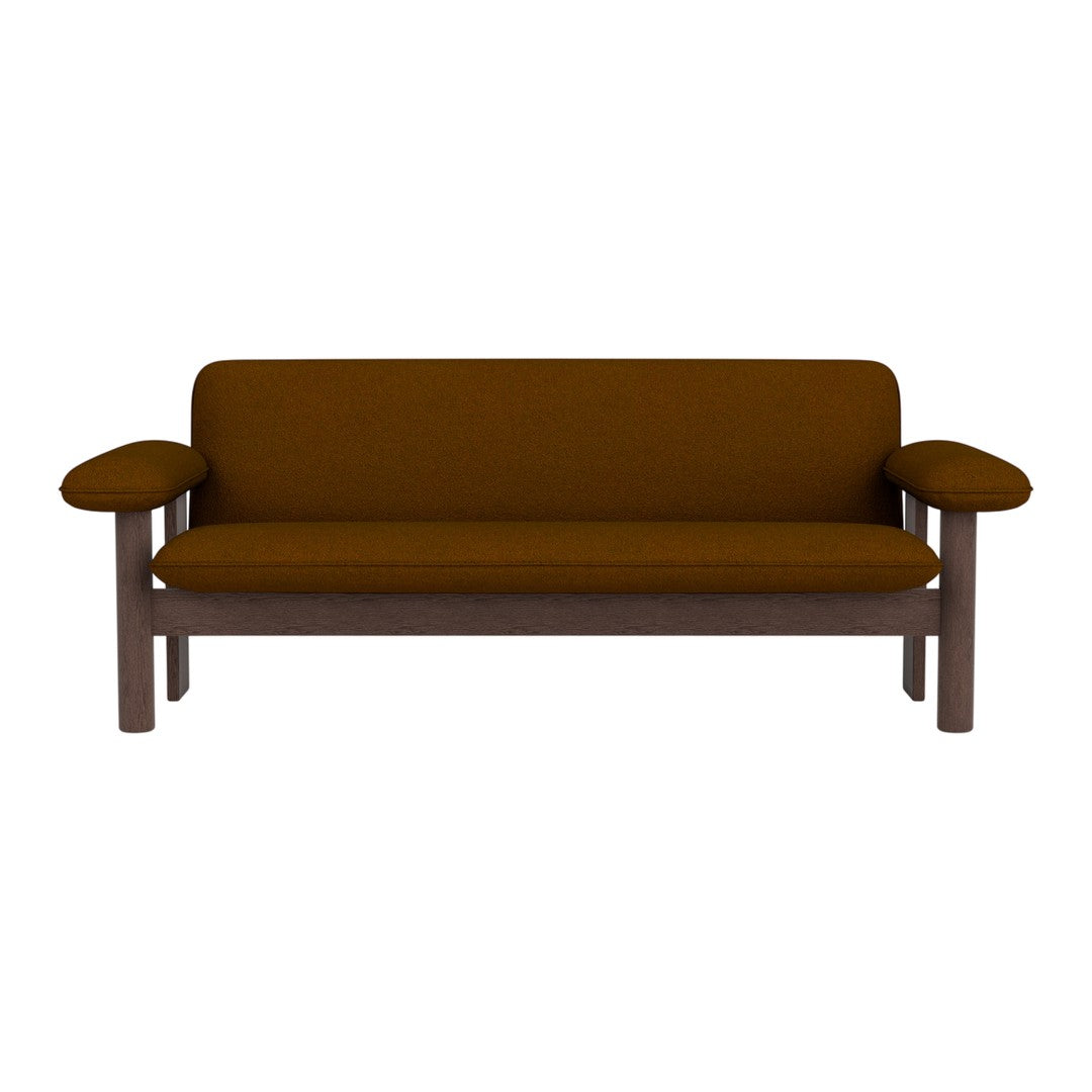 Brown upholstered sofa with sleek wooden arms, featuring a minimalist design and solid color.