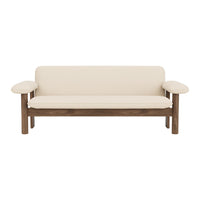 Beige upholstered sofa with wooden brown frame and smooth, minimalist design. Ideal for modern interiors.