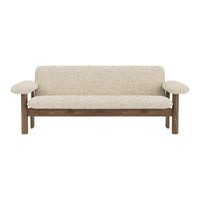Cream textured upholstery with a subtle pattern, contrasting wooden frame in warm brown tones.