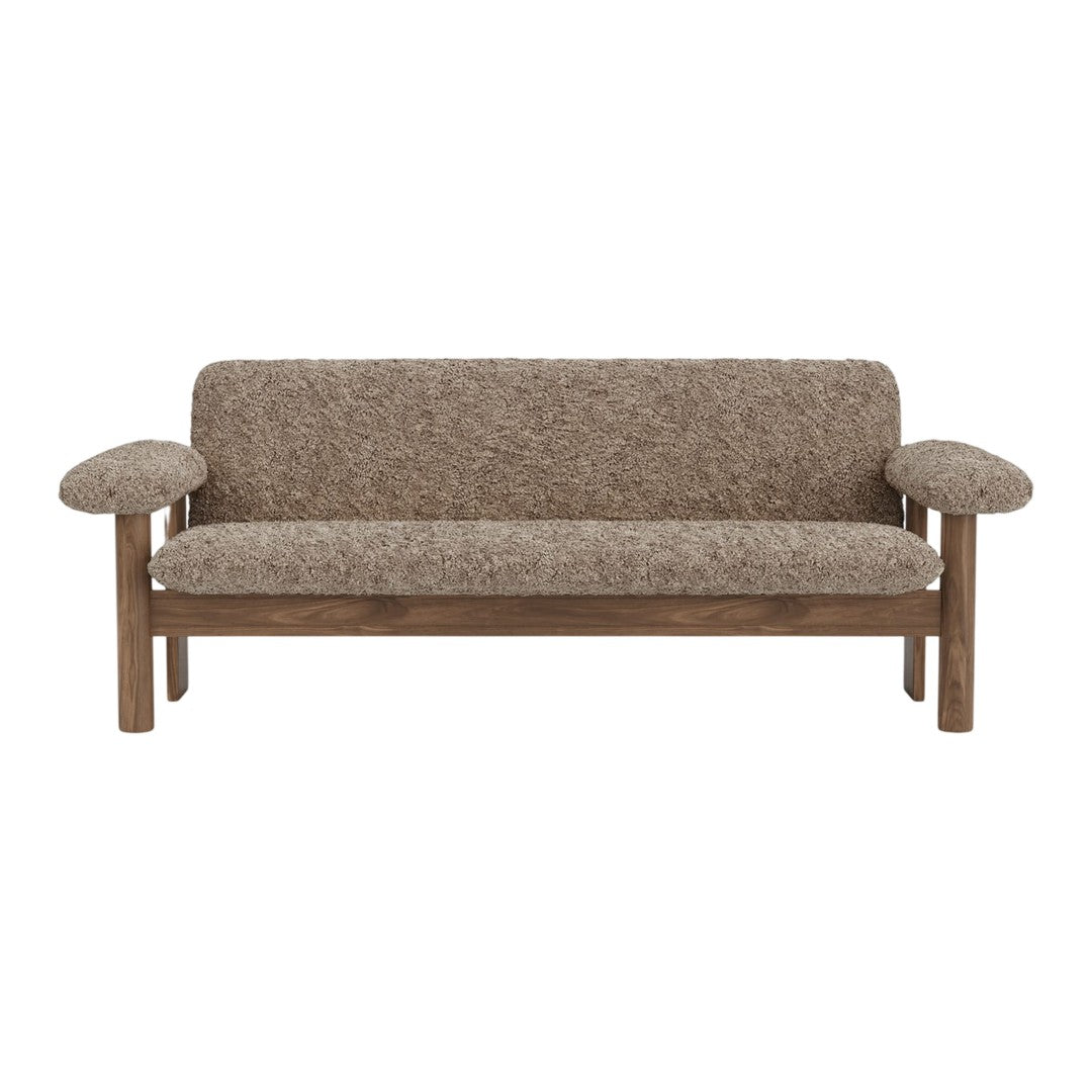 Brown textured fabric sofa with wooden arms, featuring a cozy, minimalist design. Perfect for modern interiors.