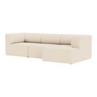Beige sectional sofa with a minimalist design and smooth, textured upholstery. Ideal for modern living spaces.