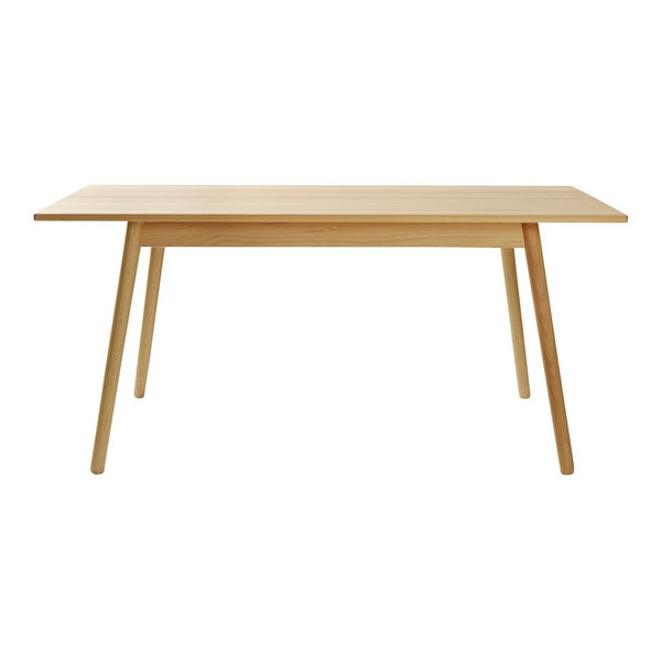 Light natural wood table with a simple, modern design and clean lines, perfect for a minimalist decor.