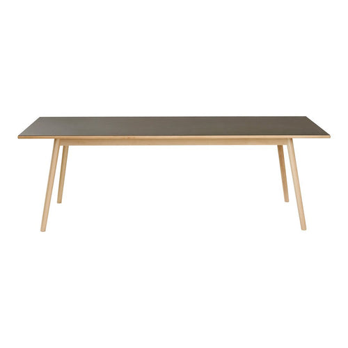 Rectangular table with a sleek gray surface and natural wood legs, showcasing a modern minimalist design.