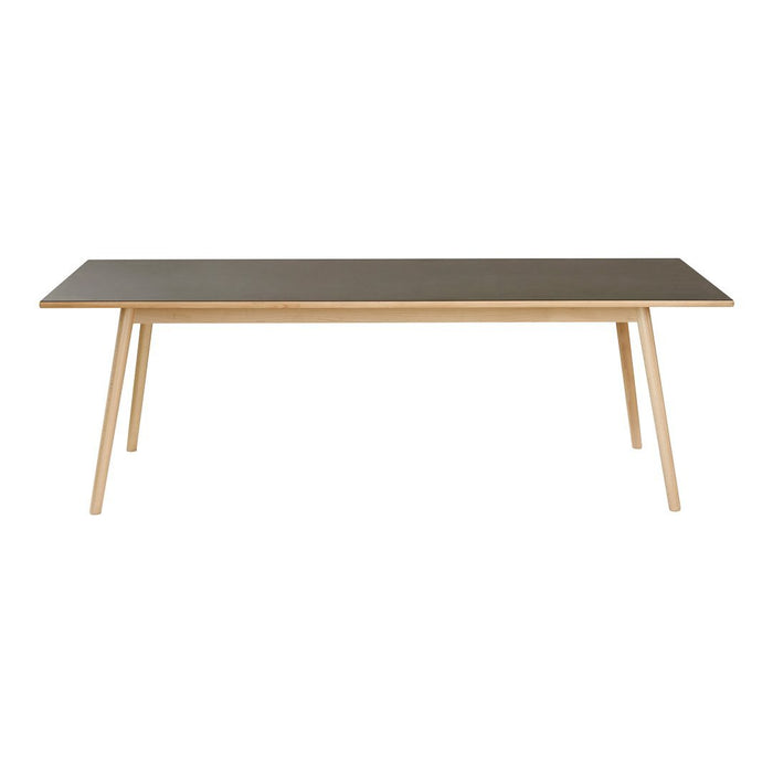 Rectangular table with a sleek gray surface and natural wood legs, showcasing a modern minimalist design.