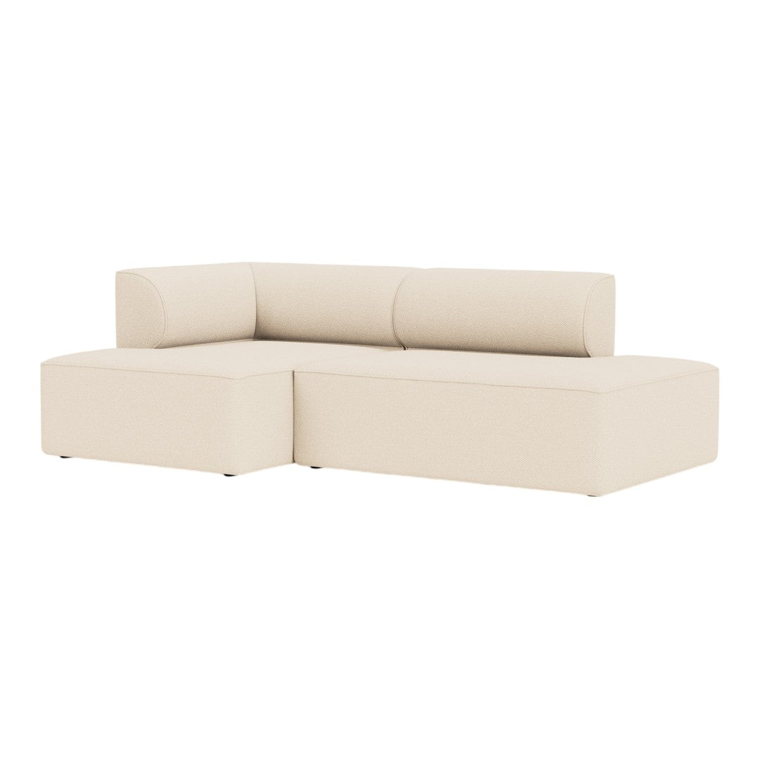 Beige L-shaped sofa with a smooth, minimalist design, featuring clean lines and no visible patterns. Perfect for modern decor.