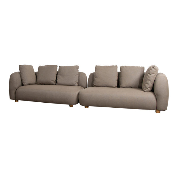 Stylish beige modular sofa with plush cushions and smooth lines, complemented by wooden legs for a modern touch.