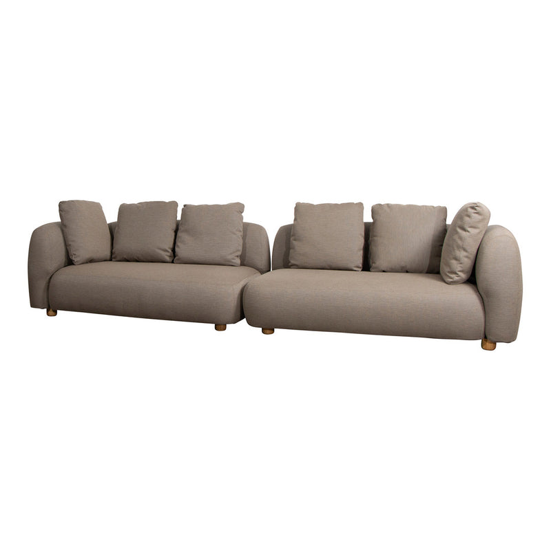 Stylish beige modular sofa with plush cushions and smooth lines, complemented by wooden legs for a modern touch.