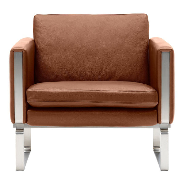 Brown leather armchair with sleek silver metal accents and minimalist design, ideal for modern interiors.