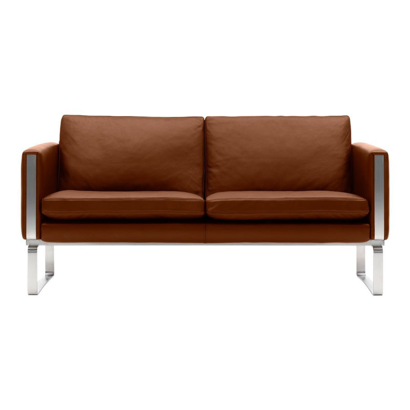 Brown leather two-seater sofa with sleek silver metal legs, featuring a minimalist design and smooth upholstery.