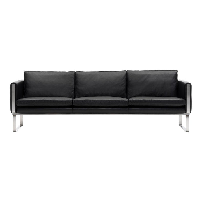 Black leather sofa with sleek chrome legs and clean, modern lines. Perfect for a contemporary living space.