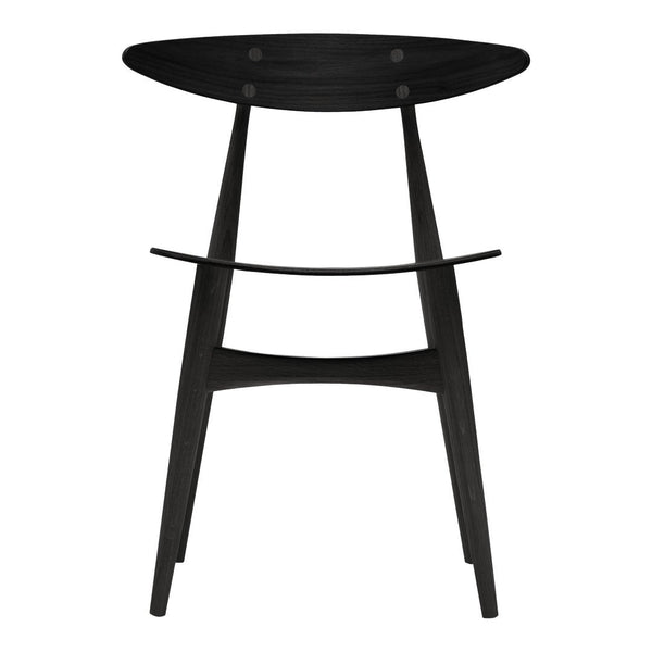 Black wooden stool with a smooth finish and minimalist design, featuring an oval seat and tapered legs.