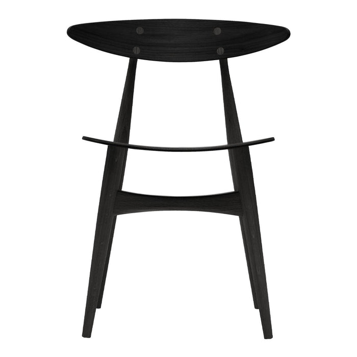 Black wooden stool with a smooth oval seat and minimalist design, featuring sleek, tapered legs and simple cutout.