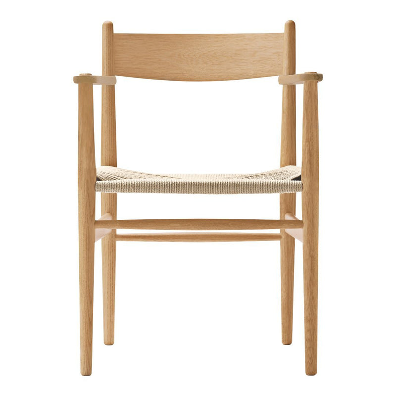 Light wood chair with a natural woven seat, featuring minimalist design and neutral tones. Perfect for modern decor.