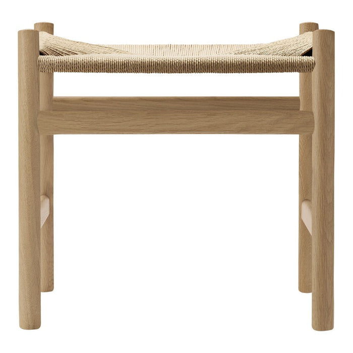 Natural wood stool with a woven beige seat and minimalist design, showcasing earthy tones and smooth textures.