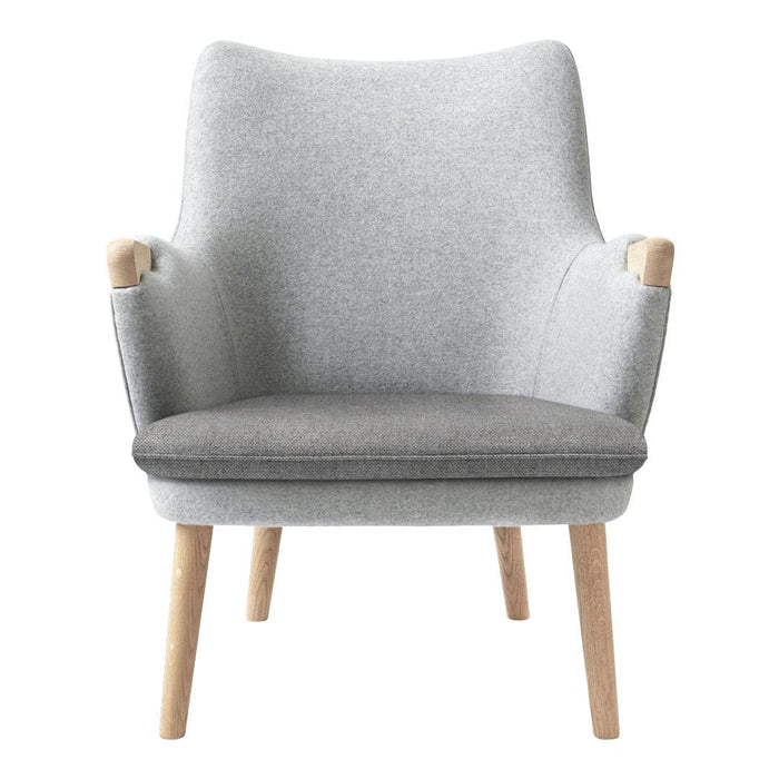 Light gray upholstered armchair with a darker gray seat cushion and natural wood legs, featuring a smooth, minimalist design.