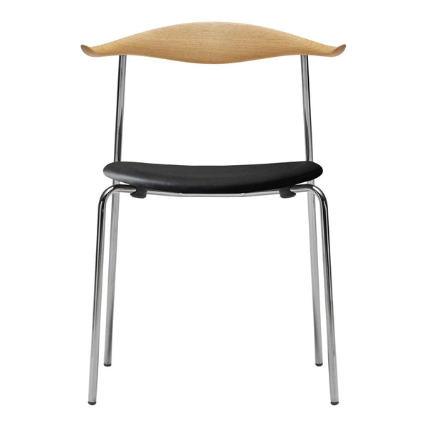 "Modern chair featuring a natural wood backrest, sleek black seat, and chrome legs for a stylish contrast."