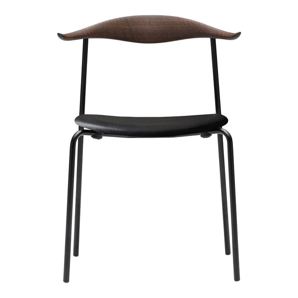 Black modern chair with a curved brown wood backrest and a sleek design, perfect for contemporary spaces.
