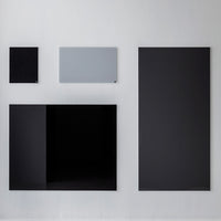 Modern wall art featuring a sleek black and gray color palette with various geometric shapes.