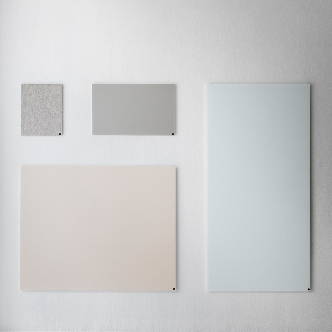 Collection of four panels in soft gray, light pastel pink, textured gray, and light blue against a neutral background.