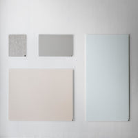 Collection of four panels in soft gray, light pastel pink, textured gray, and light blue against a neutral background.