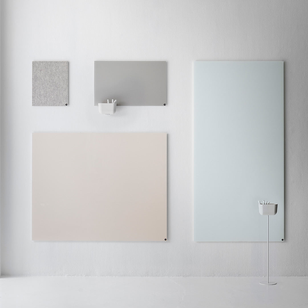 "Neutral color palette featuring soft beige, muted gray, and light blue patterns on textured wall panels."