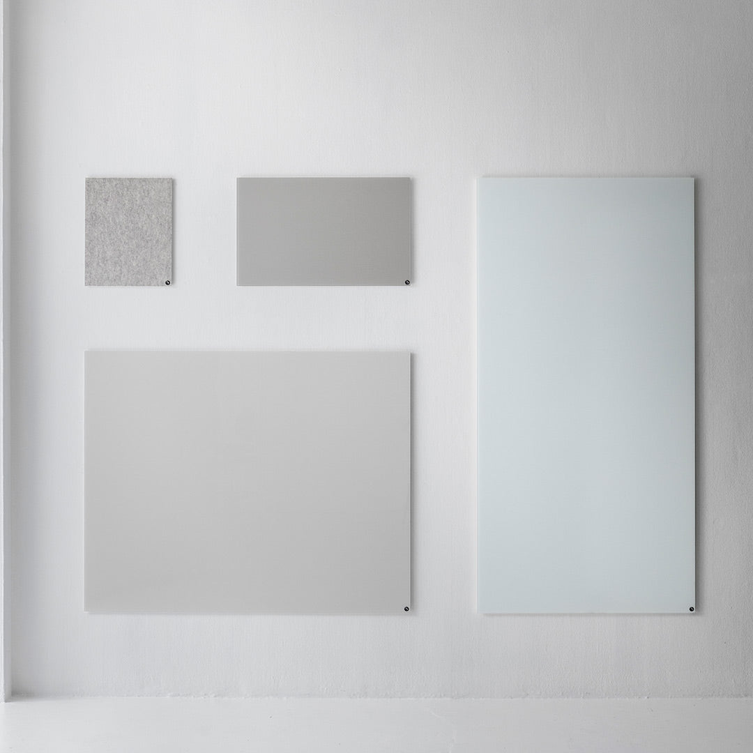 Five sleek wall panels in shades of gray, featuring subtle textures and a smooth, reflective surface.
